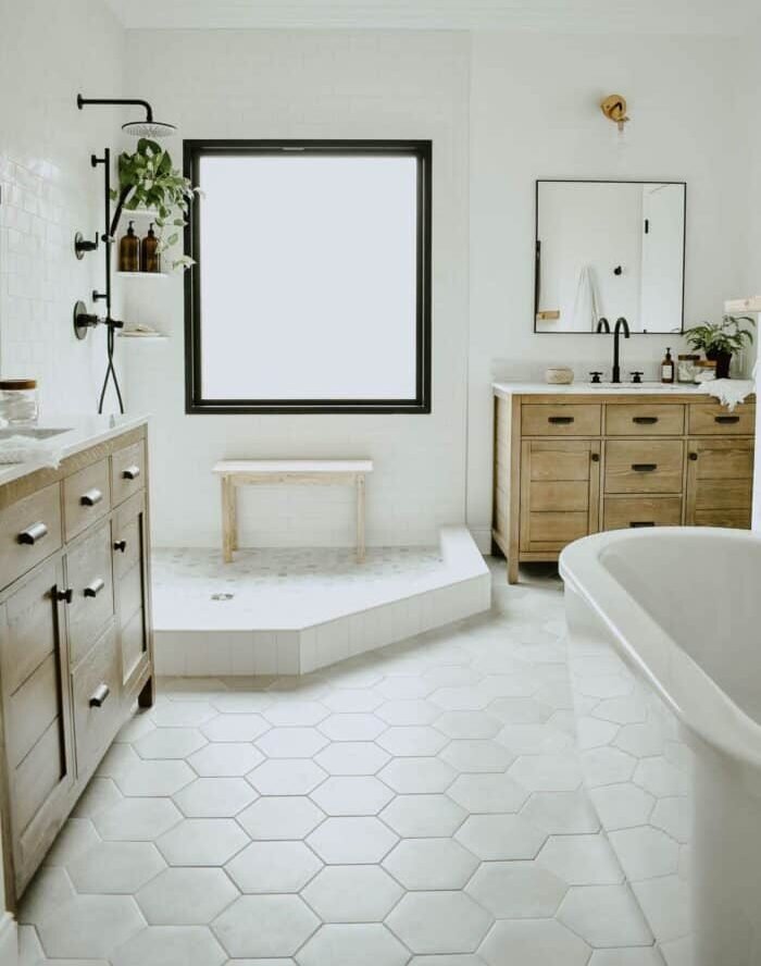 a bathroom with a tub and lights, bathroom tile ideas